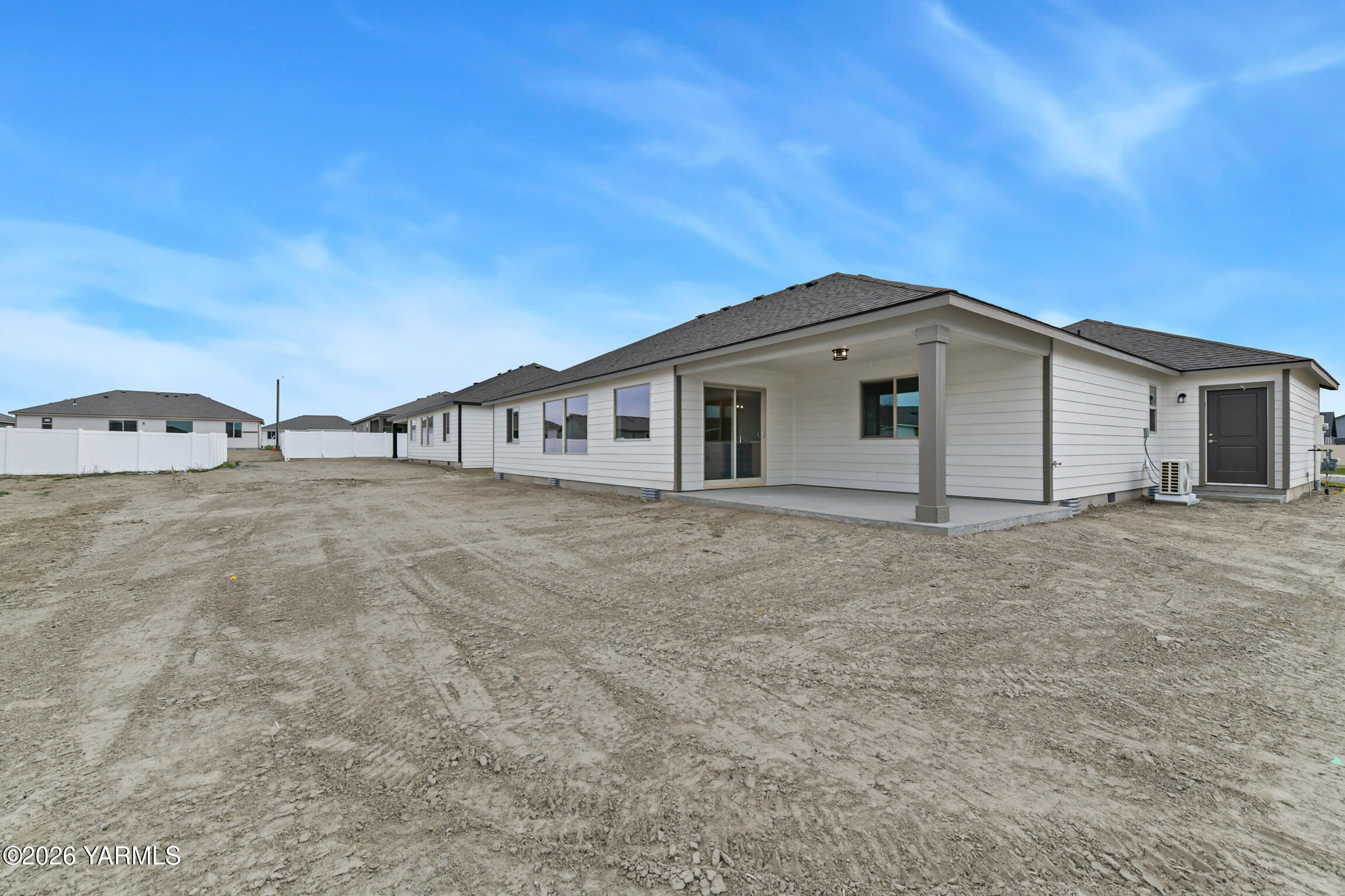 606 Grapevine Street, Unit PHASE 3 LOT 8) SPEC Grandview, WA 98930 - Photo 27 of 28 a view of a house with backyard