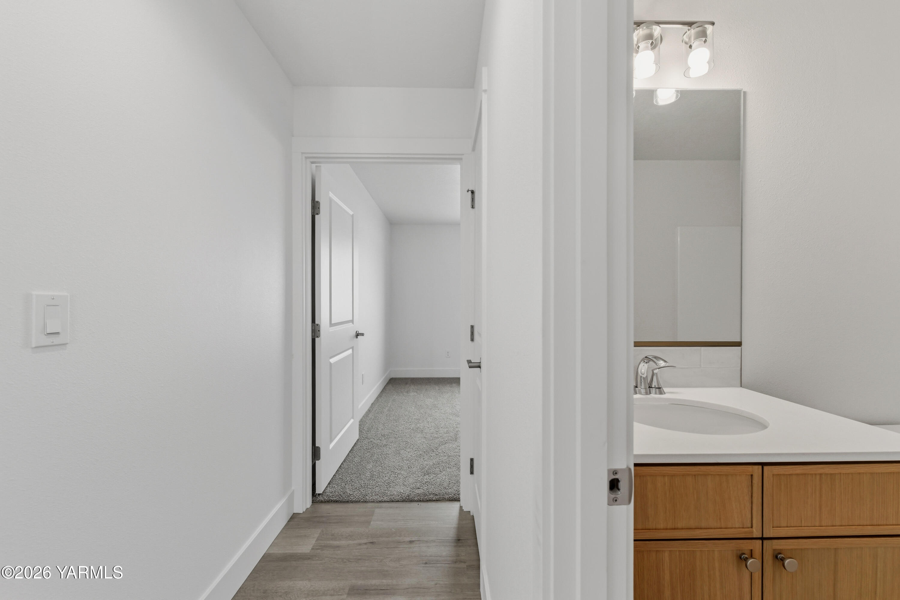 606 Grapevine Street, Unit PHASE 3 LOT 8) SPEC Grandview, WA 98930 - Photo 6 of 28 a bathroom with a sink and mirror