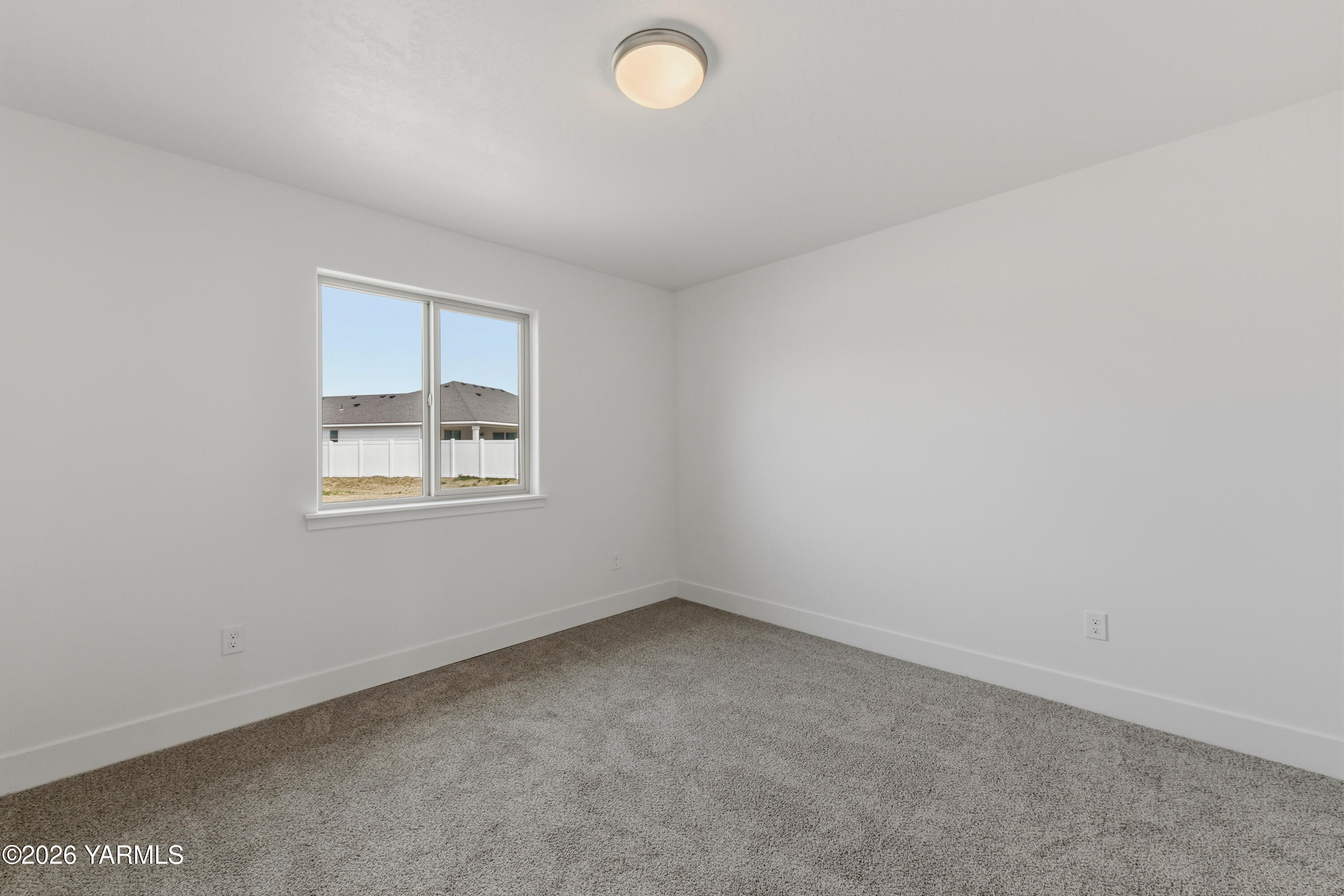 606 Grapevine Street, Unit PHASE 3 LOT 8) SPEC Grandview, WA 98930 - Photo 8 of 28 an empty room with a window