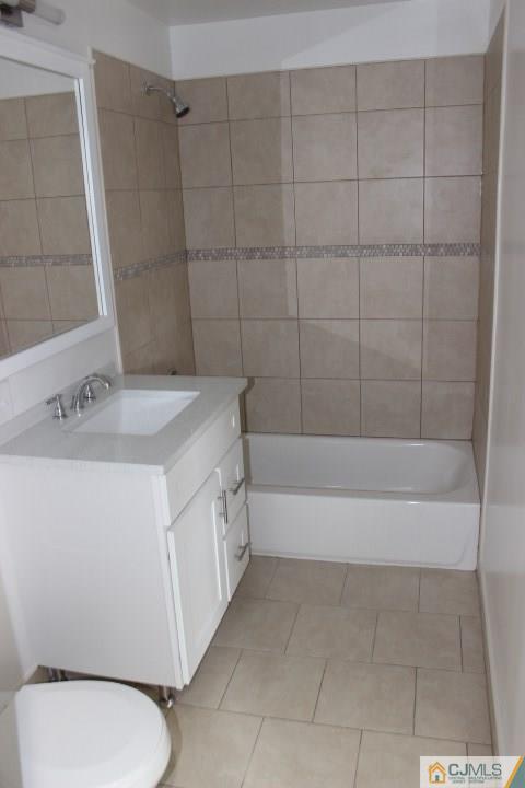 15 Sturgis Road Edison, NJ 08817 - Photo 3 of 50 a bathroom with a sink a toilet and bathtub