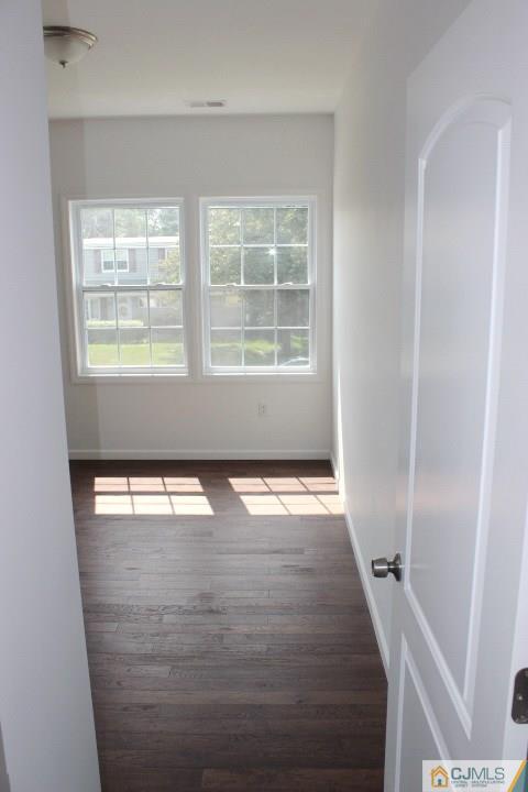 15 Sturgis Road Edison, NJ 08817 - Photo 22 of 50 an empty room with wooden floor and windows