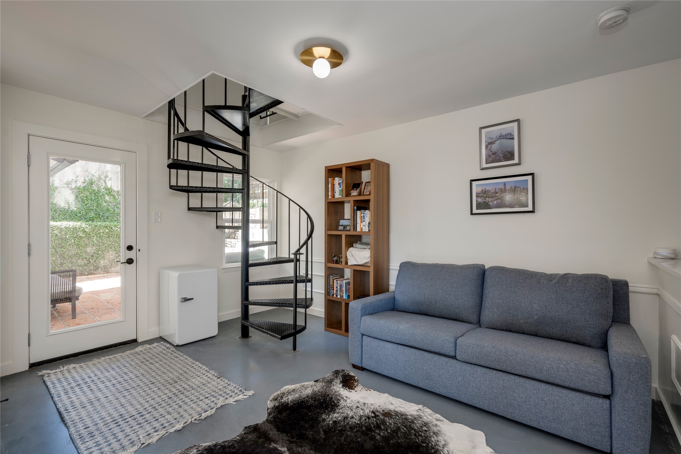 3606 Wilson Street Austin, TX 78704 - Photo 11 of 34 Living area with stairway and concrete flooring
