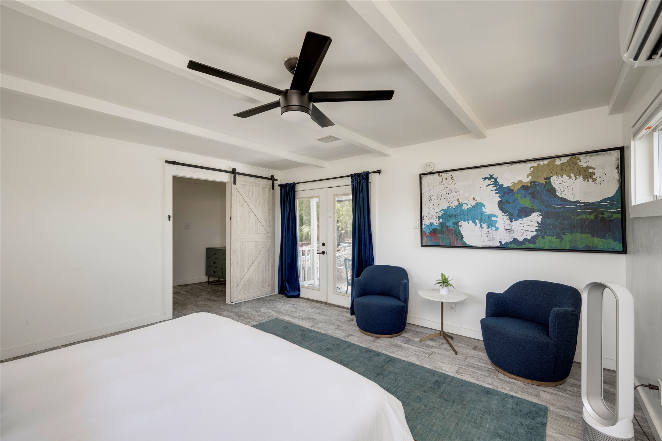 3606 Wilson Street Austin, TX 78704 - Photo 20 of 34 Bedroom featuring a barn door, ceiling fan, access to outside, french doors, and beamed ceiling
