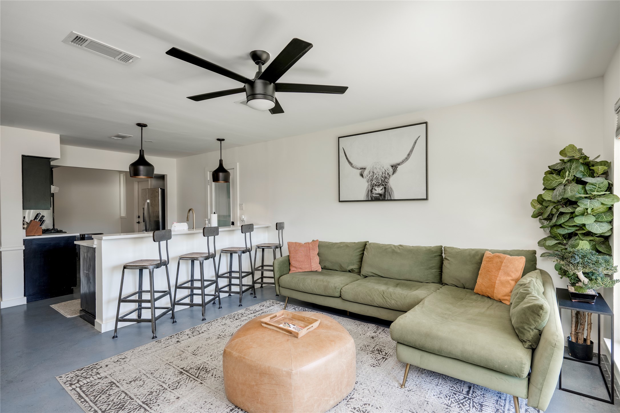 3606 Wilson Street Austin, TX 78704 - Photo 3 of 34 Living room with concrete flooring and ceiling fan