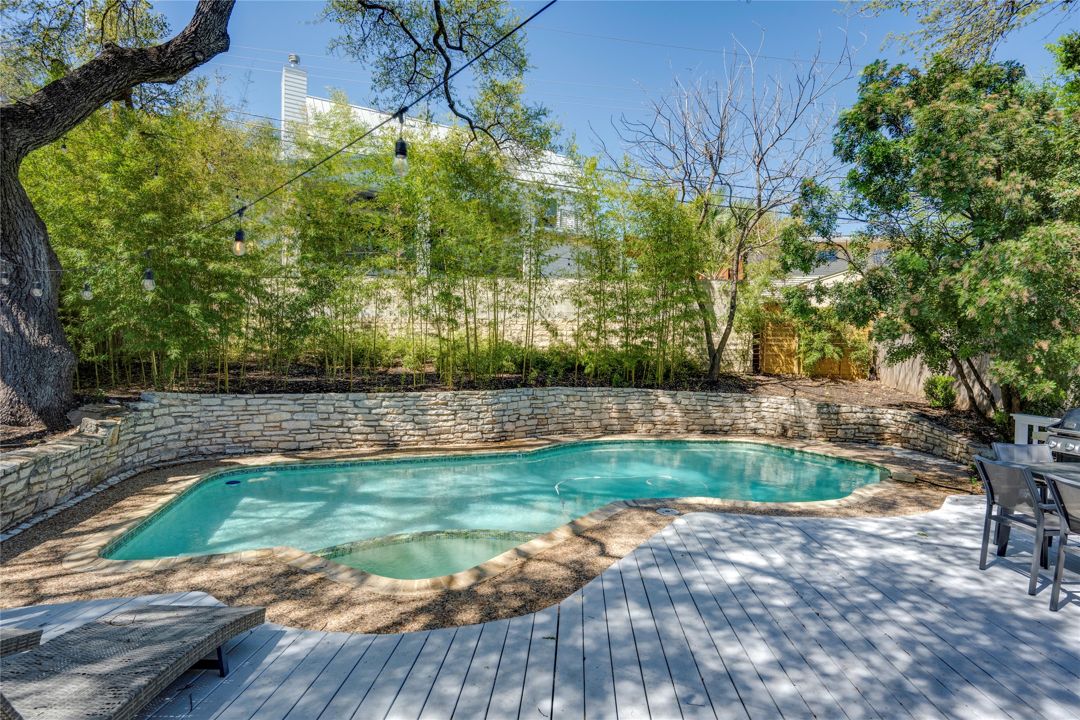 3606 Wilson Street Austin, TX 78704 - Photo 31 of 34 Swimming pool featuring a fenced backyard, a deck, and a patio area