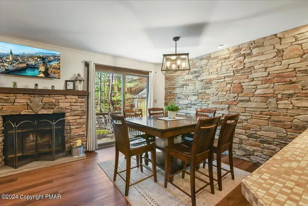 a view of a livingroom with furniture and a fireplace