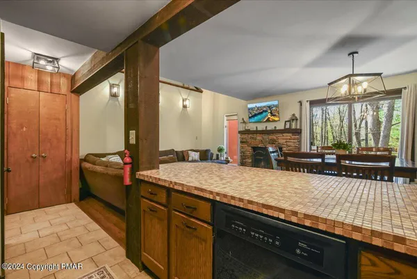 a spacious bathroom with a granite countertop sink and a mirror