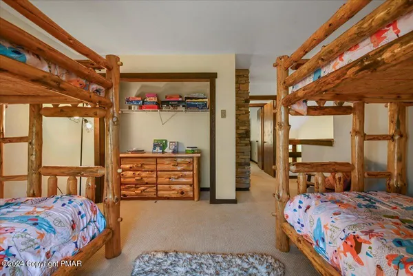 a bedroom with a bed and a table