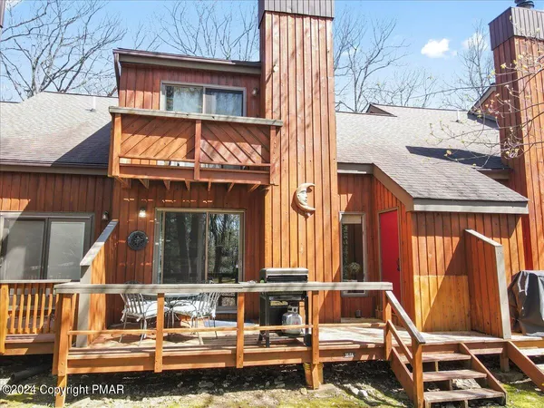 a view of sitting area in front of house