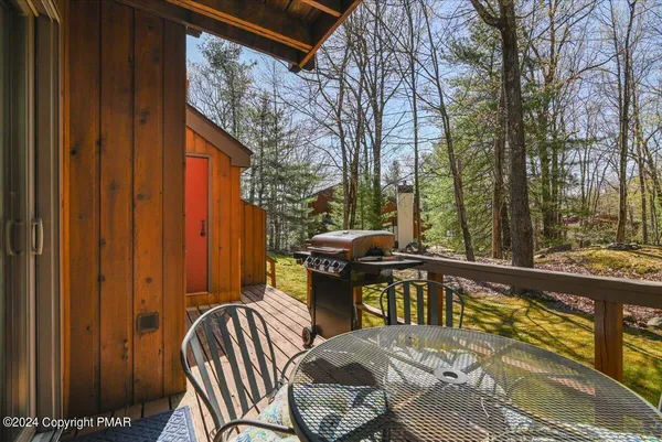 a view of a two chairs and table in the balcony