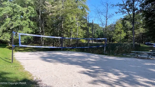 a view of a backyard with swimming pool