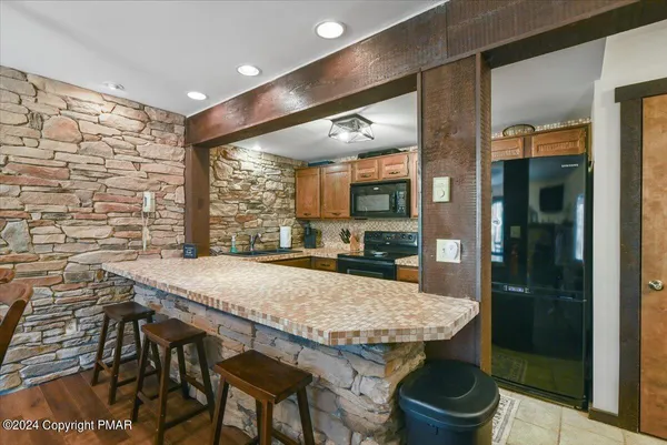 a kitchen with a table and chairs in it