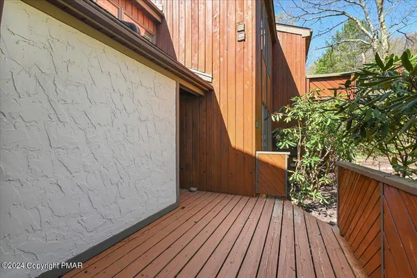 a view of outdoor space with wooden floor and staircase