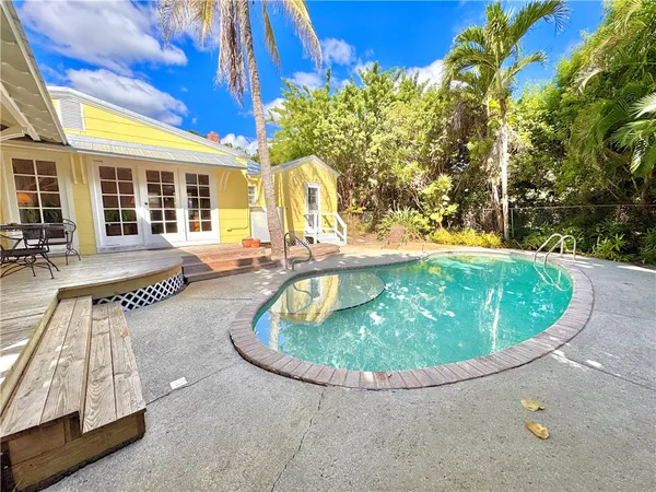 a view of a swimming pool with sitting area