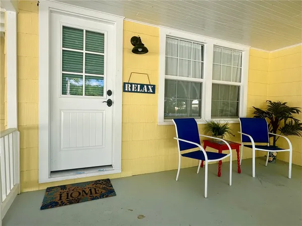 a outdoor space with a large mirror and a window