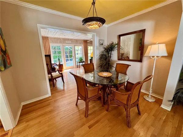 a dining room with furniture window wooden floor