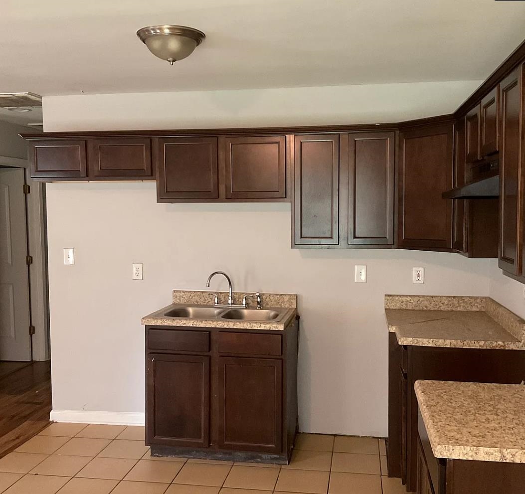 1521 Hope Street Memphis, TN 38111 - Photo 4 of 9 a kitchen with a sink and cabinets
