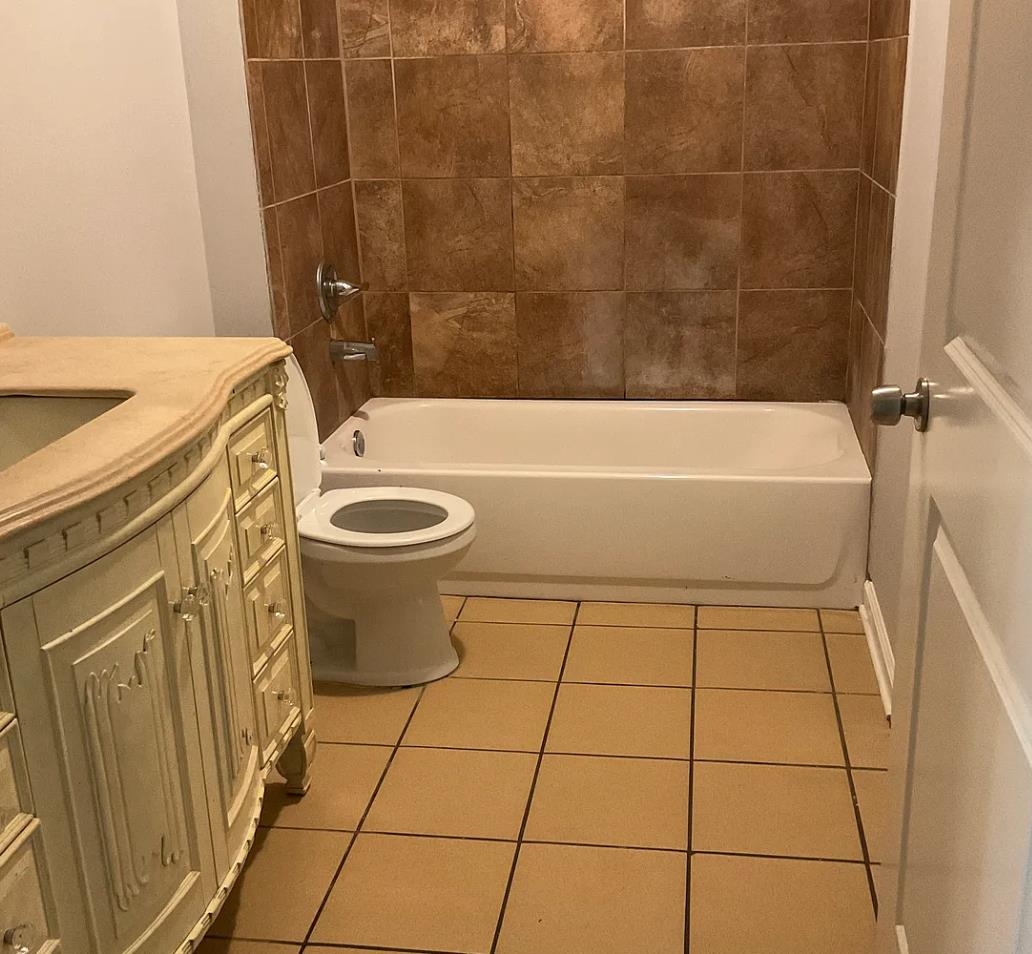 1521 Hope Street Memphis, TN 38111 - Photo 6 of 9 a bathroom with a sink and a bathtub