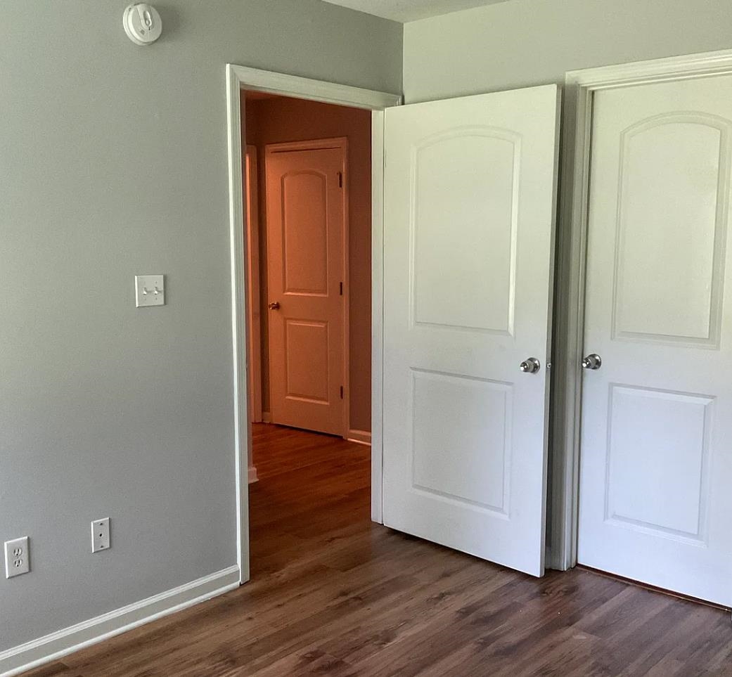1521 Hope Street Memphis, TN 38111 - Photo 8 of 9 an empty room with wooden floor and closet