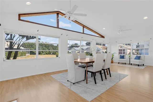 a view of a dining room with furniture and window