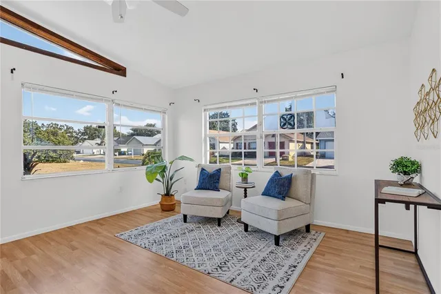 a living room with furniture and a rug