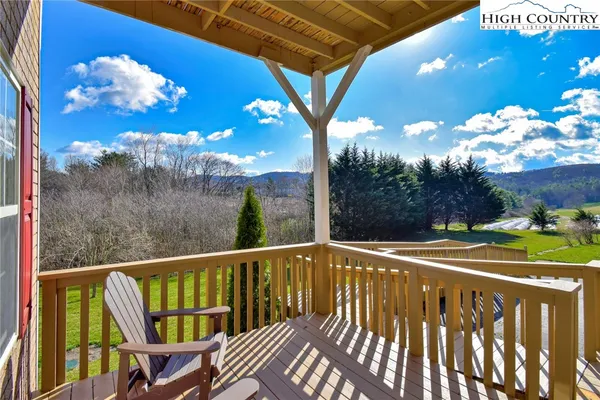 a view of a balcony with wooden floor