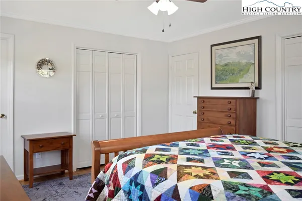 a bedroom with a bed and a fireplace