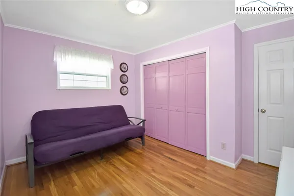 a couch sitting in a room next to a window