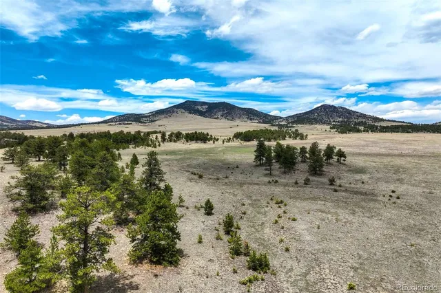 a view of a lake with sunset