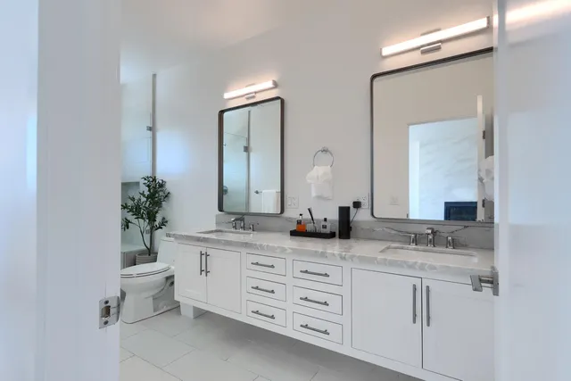 a bathroom with sink granite and a vanity
