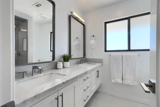 an aerial view of a house with a yard and a garage