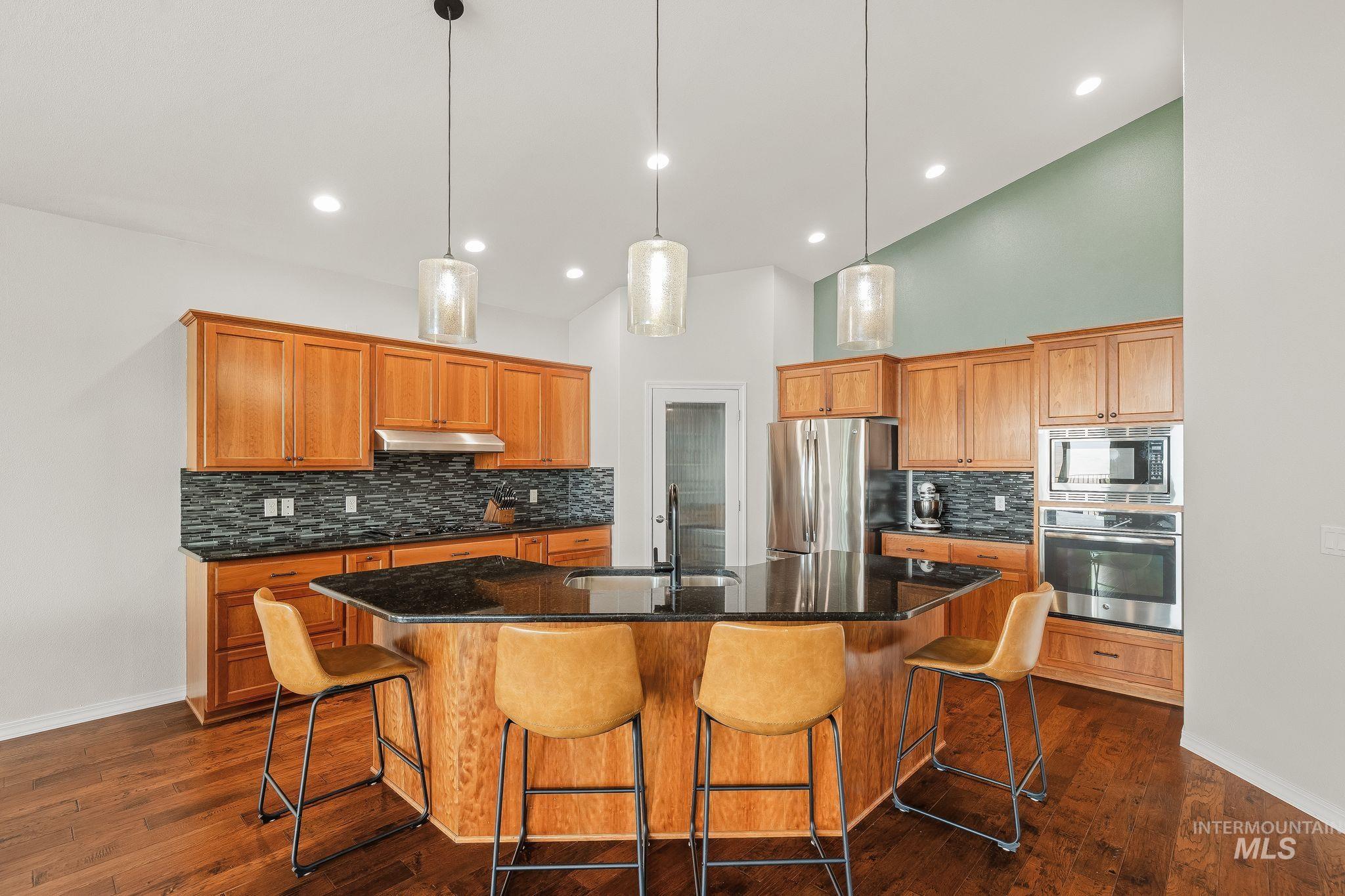 602 Quarry Road Asotin, WA 99402 - Photo 9 of 49 Kitchen featuring a multi-sided island with a dark countertop and pendant lighting