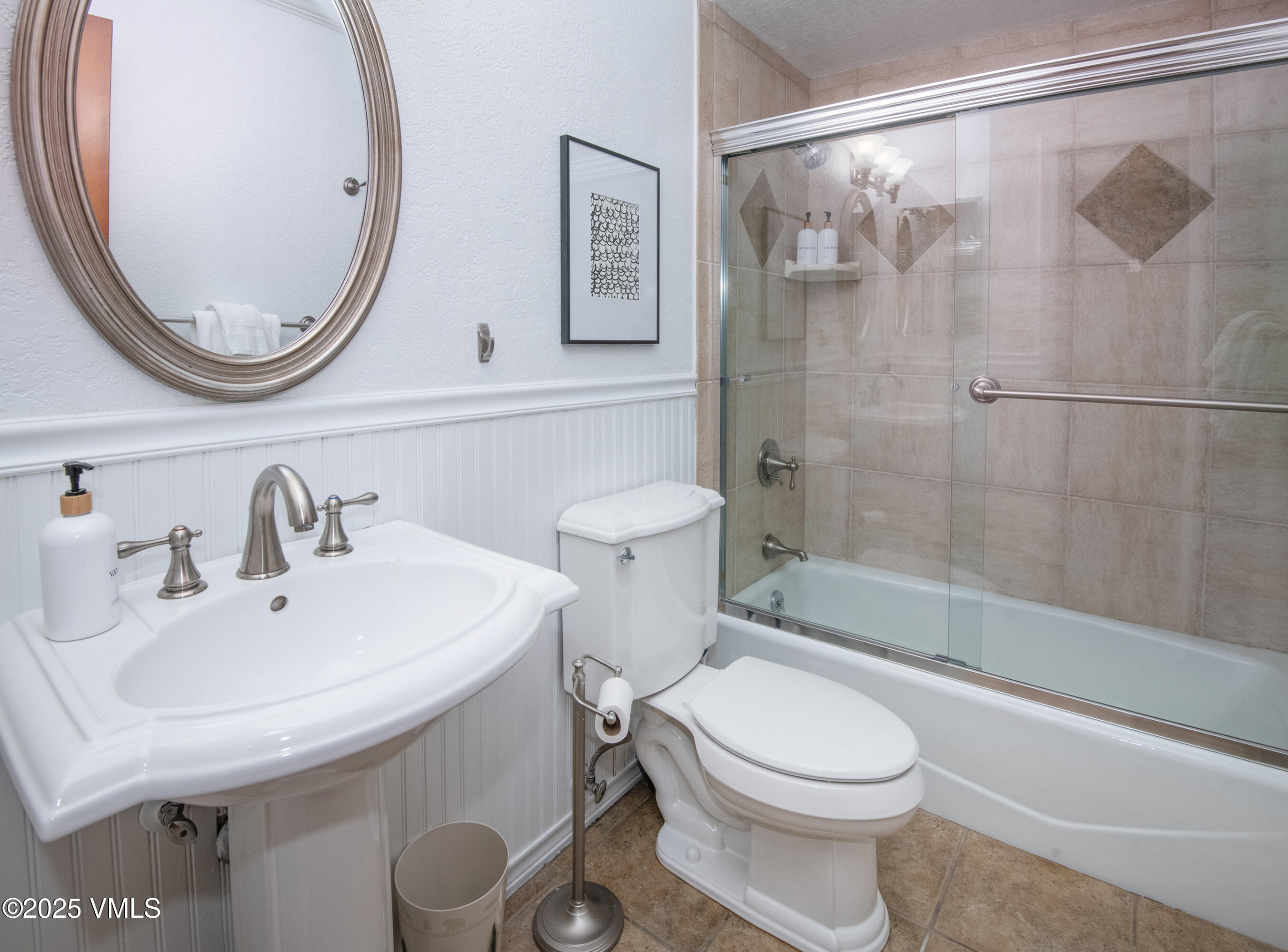 4479 Timber Falls Court, Unit 2001 Vail, CO 81657 - Photo 12 of 27 a bathroom with a sink a toilet and a mirror