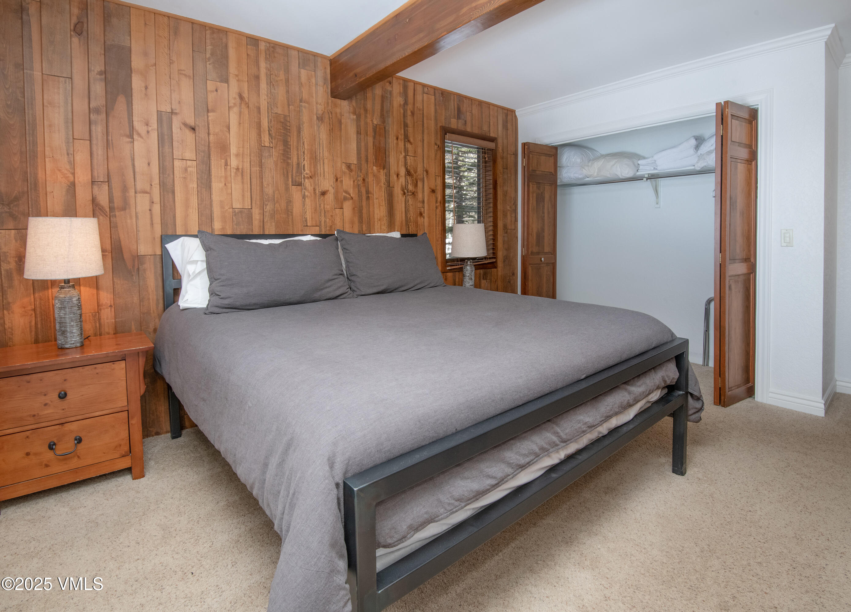 4479 Timber Falls Court, Unit 2001 Vail, CO 81657 - Photo 14 of 27 a bedroom with a bed and a dresser