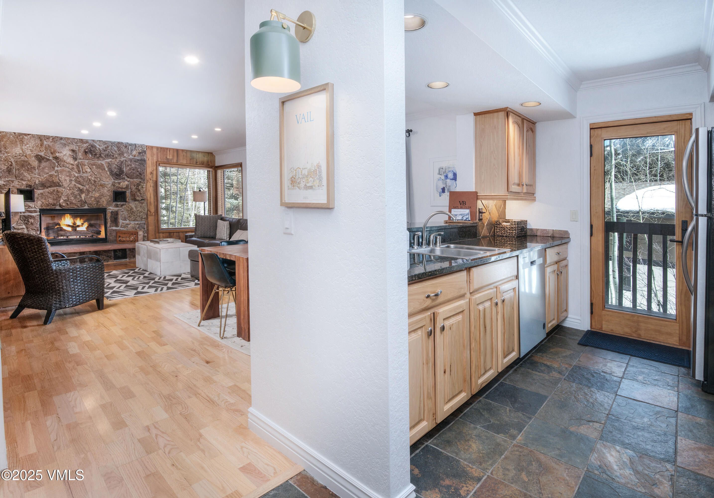 4479 Timber Falls Court, Unit 2001 Vail, CO 81657 - Photo 2 of 27 a large white kitchen with a large window