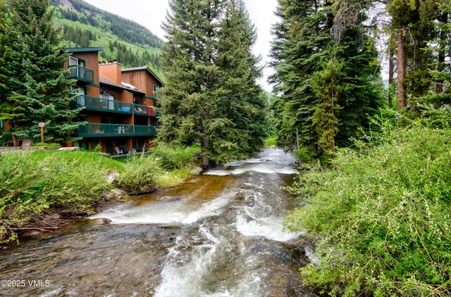 a view of a backyard with swimming pool