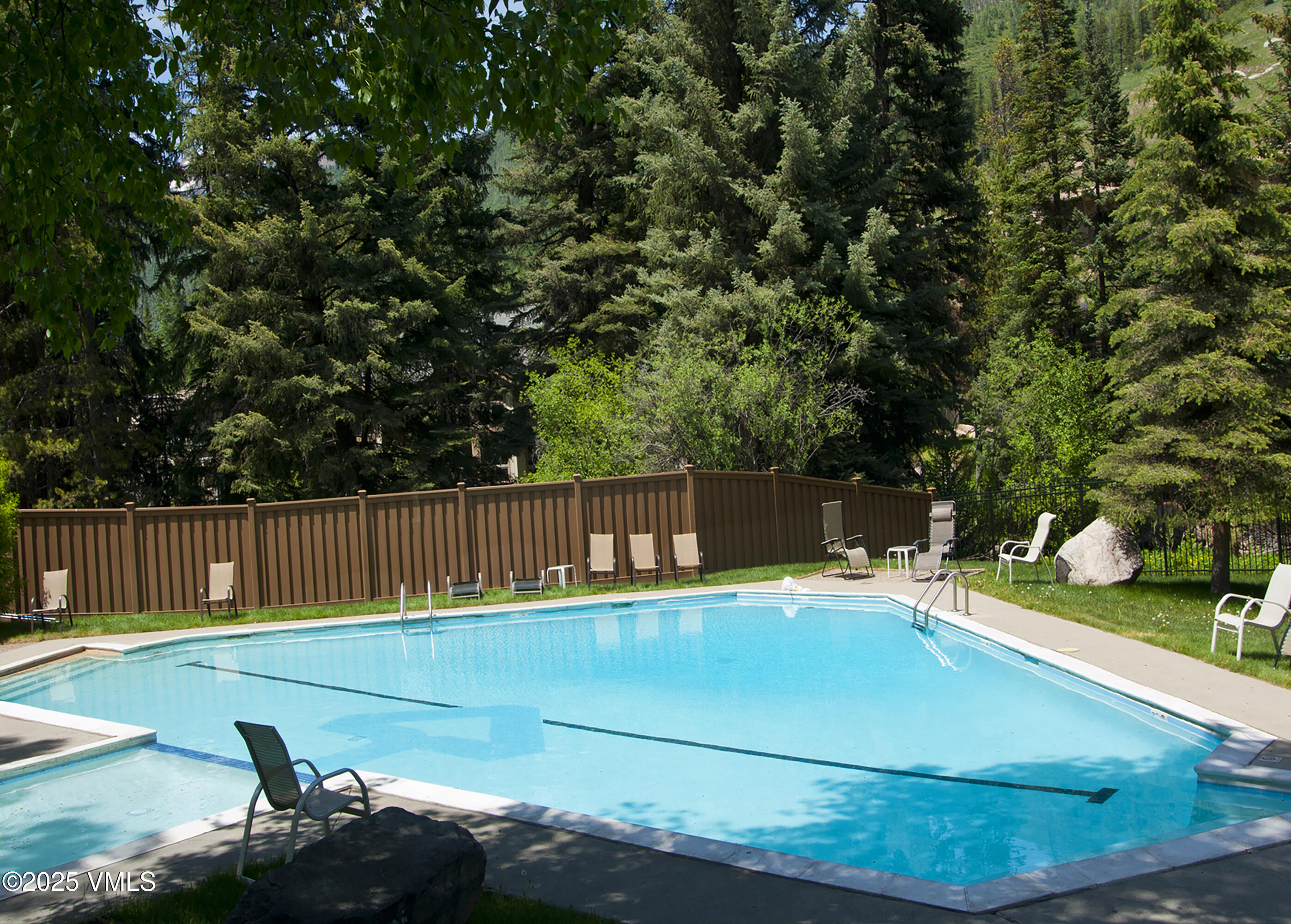 4479 Timber Falls Court, Unit 2001 Vail, CO 81657 - Photo 23 of 27 a view of a backyard with swimming pool