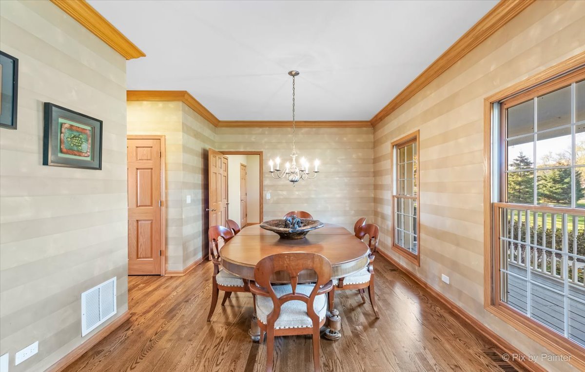 9N523 Kendall Road Elgin, IL 60124 - Photo 14 of 60 a dining room with furniture window and wooden floor