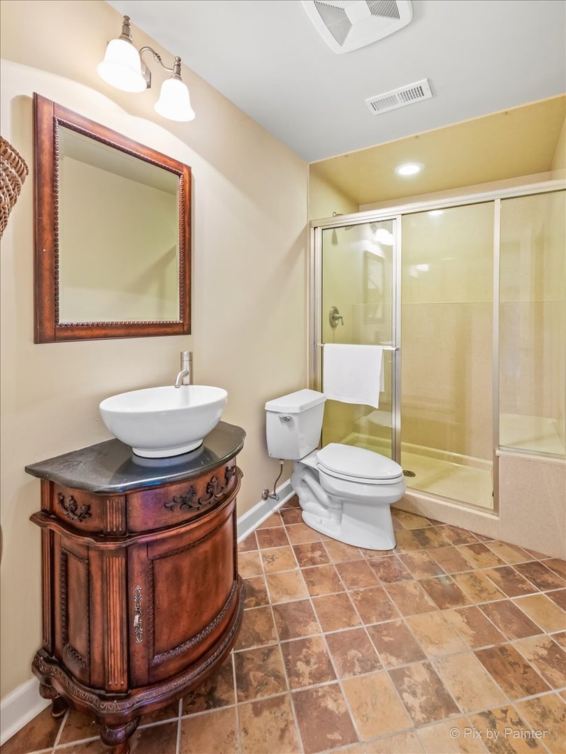 9N523 Kendall Road Elgin, IL 60124 - Photo 19 of 60 a bathroom with a toilet sink and mirror