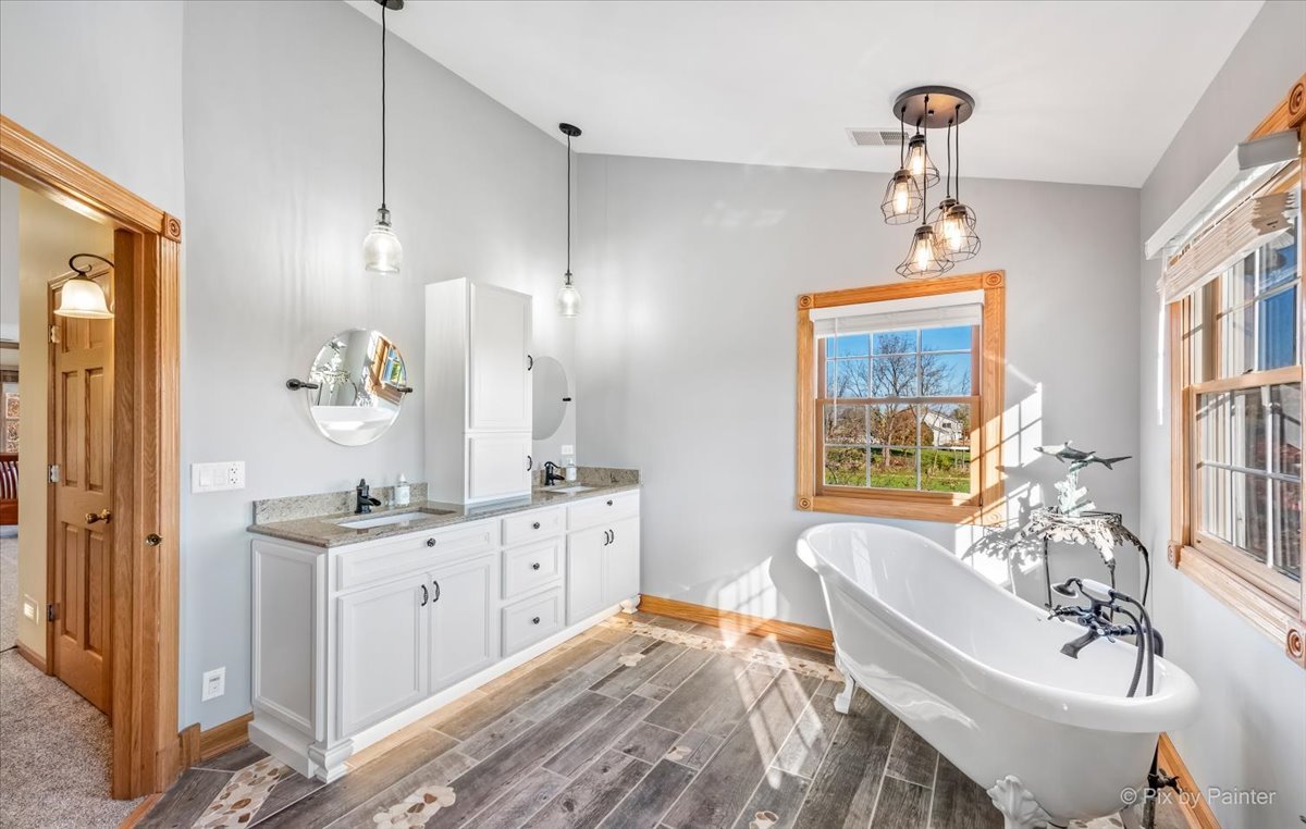9N523 Kendall Road Elgin, IL 60124 - Photo 22 of 60 a bath room with a sink bath tub and a mirror