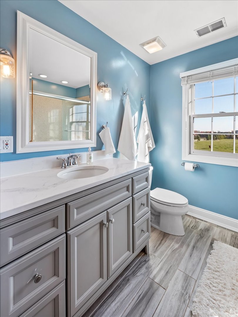 9N523 Kendall Road Elgin, IL 60124 - Photo 24 of 60 a bathroom with a sink and a mirror
