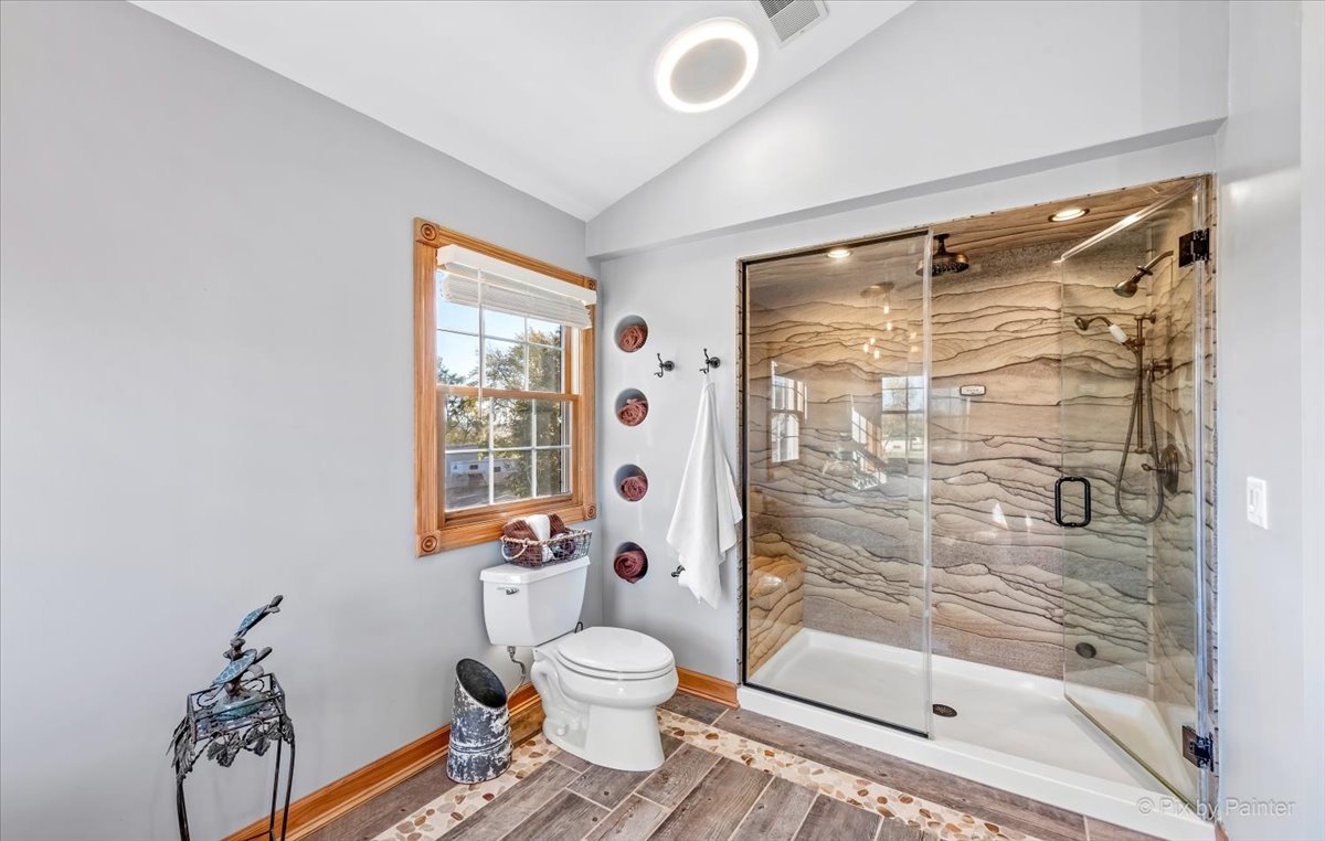9N523 Kendall Road Elgin, IL 60124 - Photo 25 of 60 a bathroom with a shower toilet and a window