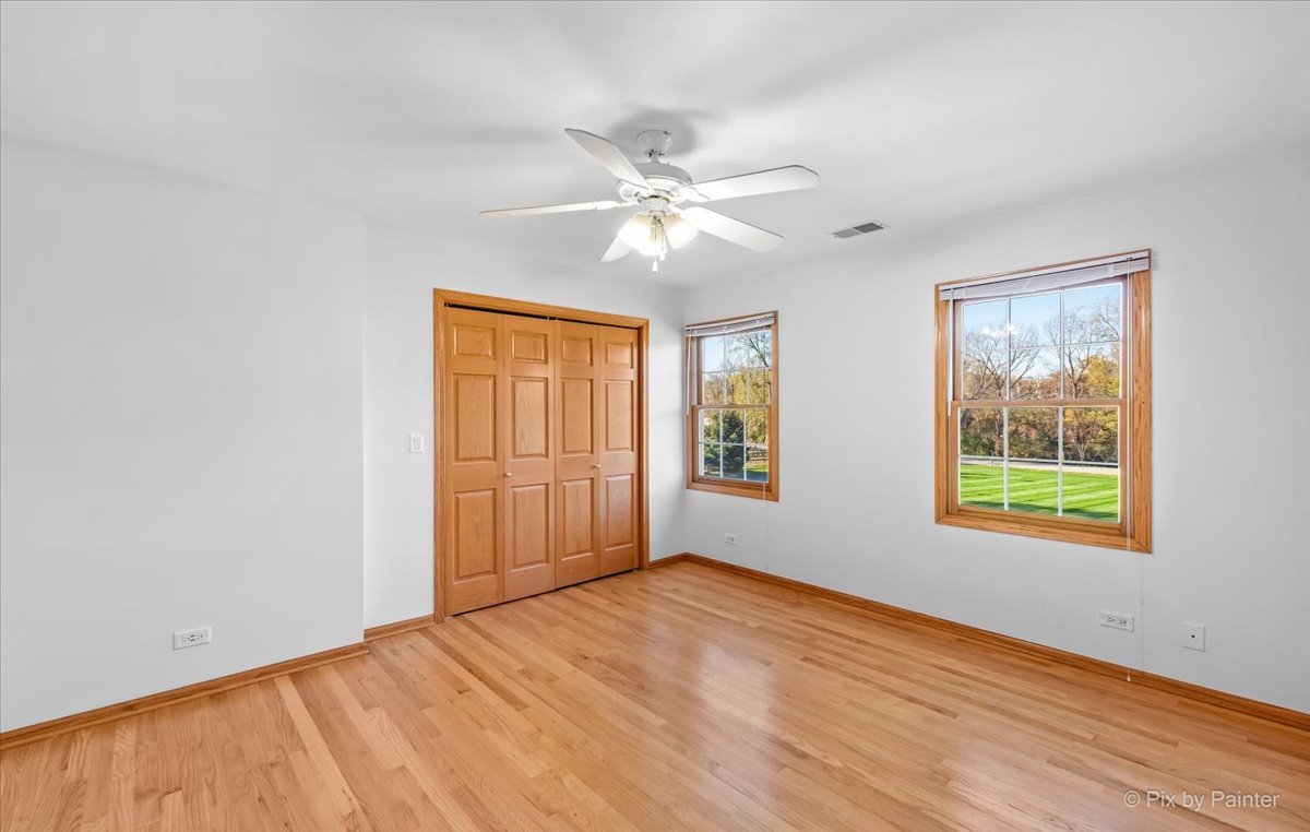 9N523 Kendall Road Elgin, IL 60124 - Photo 26 of 60 wooden floor in an empty room with a window