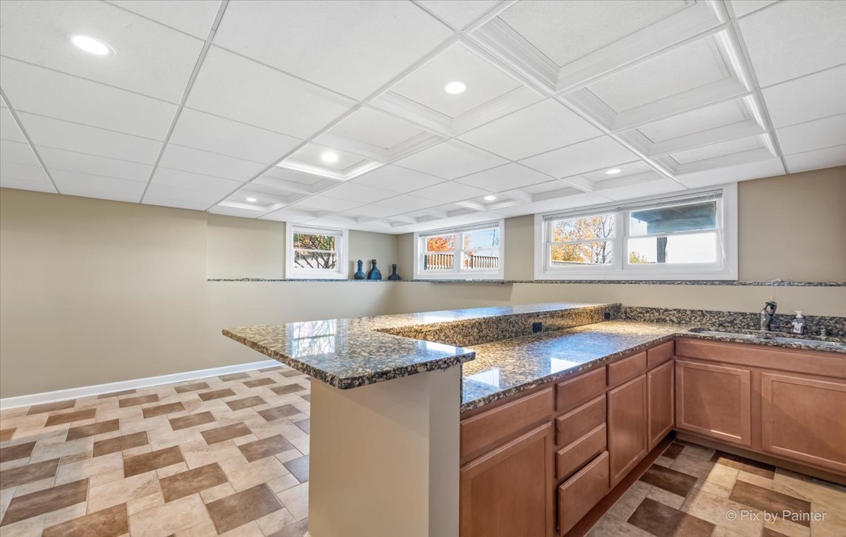 9N523 Kendall Road Elgin, IL 60124 - Photo 33 of 60 a kitchen with a sink and cabinets