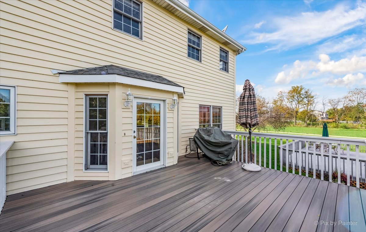 9N523 Kendall Road Elgin, IL 60124 - Photo 39 of 60 a view of a wooden deck with a table and chairs