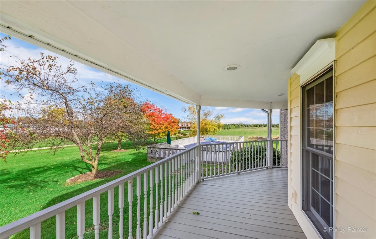 9N523 Kendall Road Elgin, IL 60124 - Photo 5 of 60 a view of a balcony with floor to ceiling windows with wooden fence