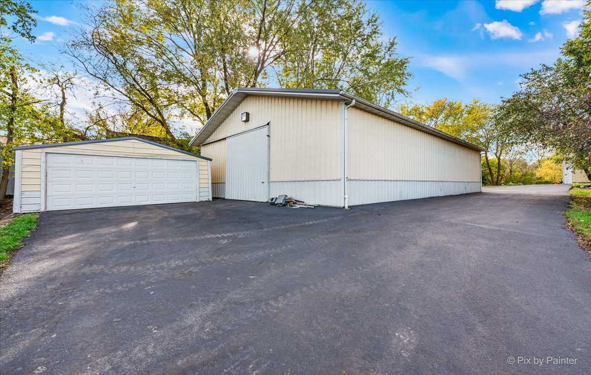 9N523 Kendall Road Elgin, IL 60124 - Photo 42 of 60 a view of a house with a yard and garage