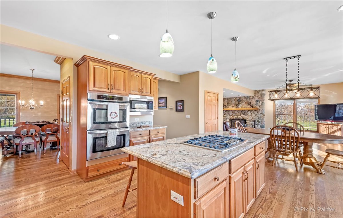 9N523 Kendall Road Elgin, IL 60124 - Photo 7 of 60 a kitchen that has a table chairs and wooden floor