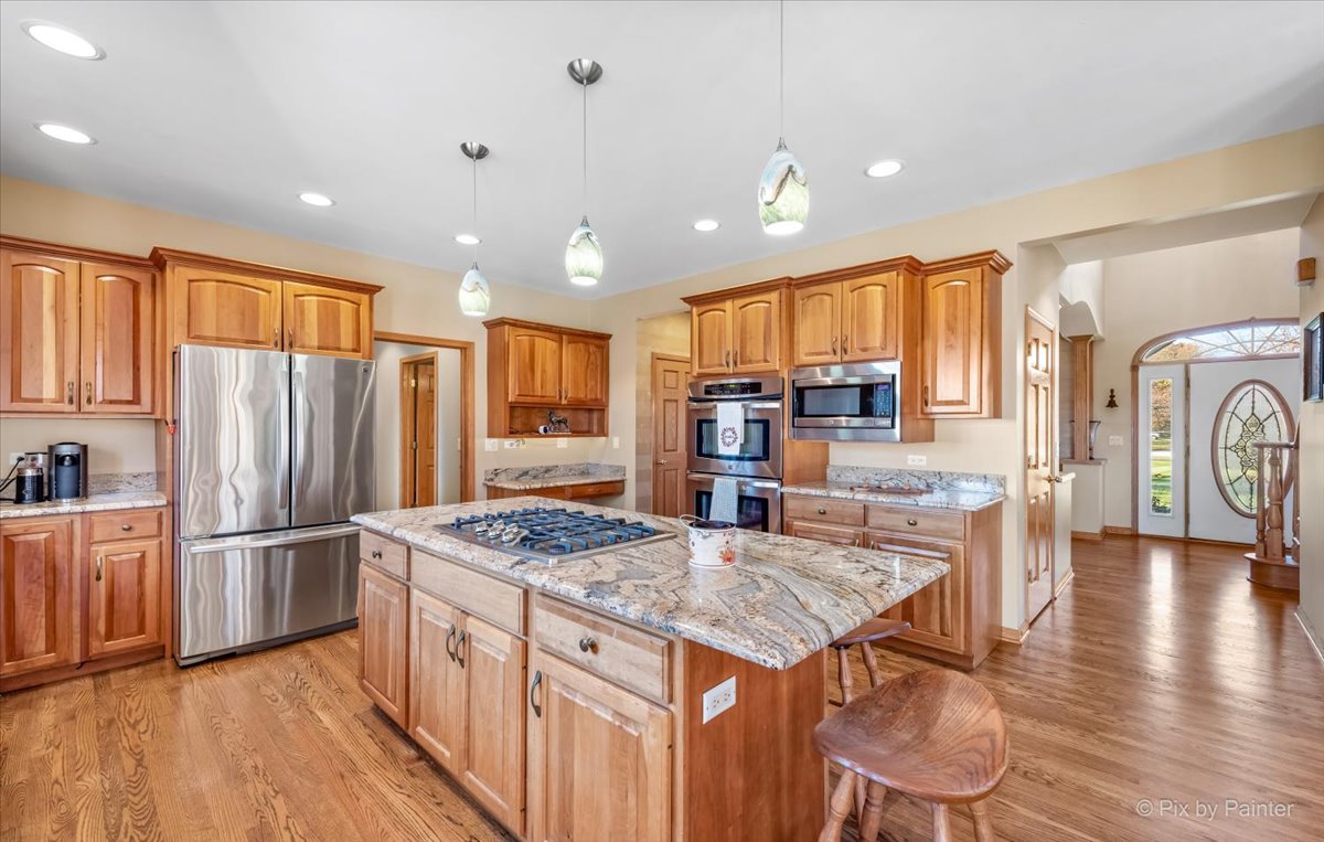 9N523 Kendall Road Elgin, IL 60124 - Photo 8 of 60 a kitchen with stainless steel appliances granite countertop a refrigerator a stove top oven and a refrigerator