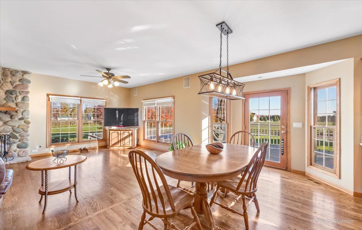 9N523 Kendall Road Elgin, IL 60124 - Photo 10 of 60 a dining room with furniture a chandelier and wooden floor